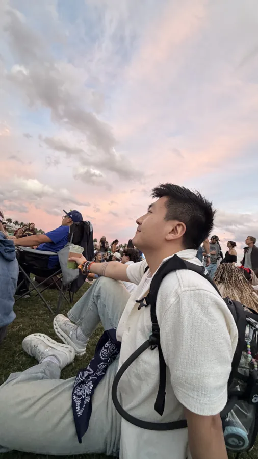 Kelvin in a crowd at a sunset street event